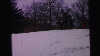 1964: a boy learning carefully how to ski on a mountain in a snowy day CAMDEN