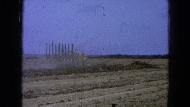 1965: men working in the field making furrows with an adapted machine MEXICO