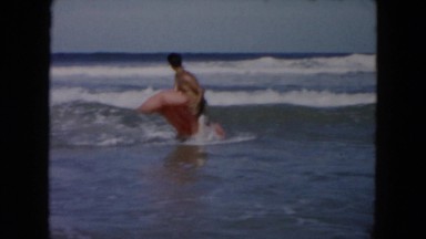 1961: water play surfing board heavy waves MICHIGAN