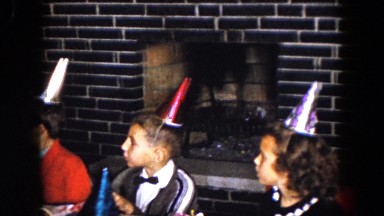 1961: children wearing party hats at a birthday party. MICHIGAN