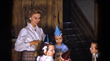 1961: adult female and several children at birthday party MICHIGAN