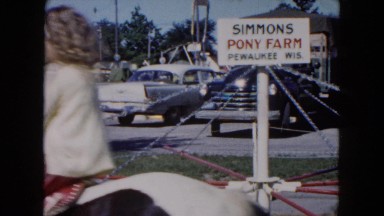 1961: children riding various ponies in a circle on simmons pony farm MICHIGAN