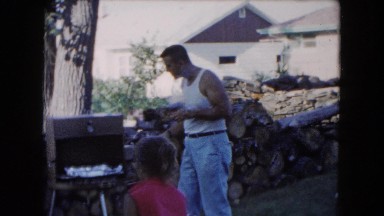 1961: dog in yard with owners smoking MICHIGAN