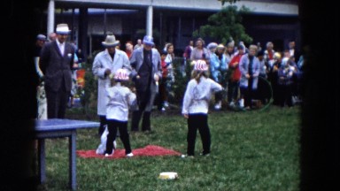 1961: two young girls in matching outfits show their dog at a dog show