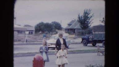 1961: a mother, two daughters and a dog on a windy winter weather walk MICHIGAN