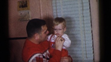 1964: father holding child making fun cheering boy CAMDEN, NEW JERSEY