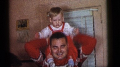 1964: father lift child on top playing happy love CAMDEN, NEW JERSEY