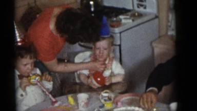 1964: Children and Adults Attending a Birthday Party Eating Cake