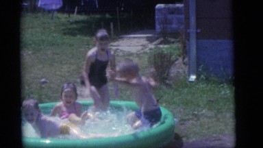 1964: the children have fun in the backyard during break CAMDEN, NEW JERSEY