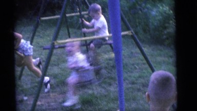 1964: children swinging while another child has a bat CAMDEN, NEW JERSEY