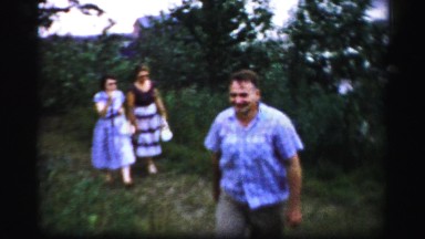1956: One Man and Two Women Walking Outdoors in Boston
