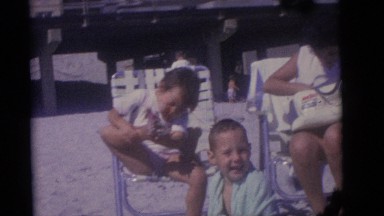 1964: the young boy cleans off his foot with passion to stay clean CAMDEN
