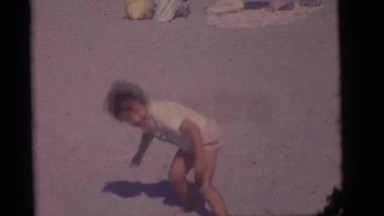 1964: a boy is doing somersaults a woman is combing her hair