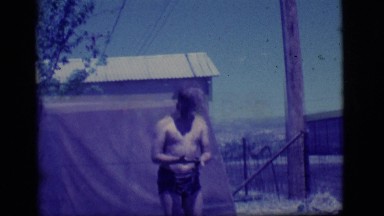 1968: one boy is lying in poodle and another one stands nearby COTTONWOOD