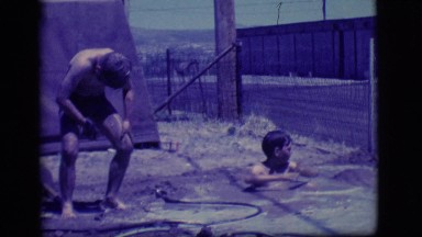 1968: two boys taking bath in the poodle in a public place COTTONWOOD, ARIZONA