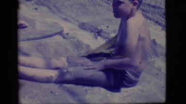 1968: two young boys rolling around in disgusting water COTTONWOOD, ARIZONA