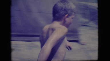 1968: two young boys playing in a muddy puddle outdoor COTTONWOOD, ARIZONA