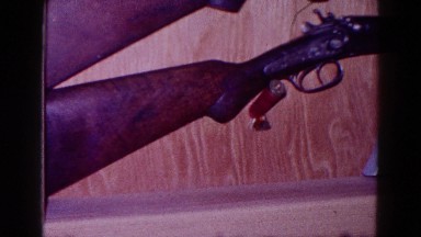 1968: a group of rifles and pistols are displayed on a counter MINNESOTA
