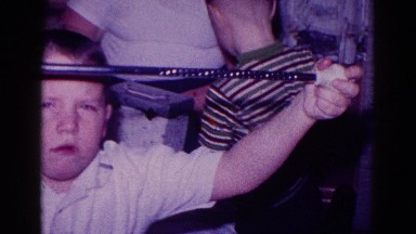 1968: group of little boys playing with toys they take from a box MINNESOTA