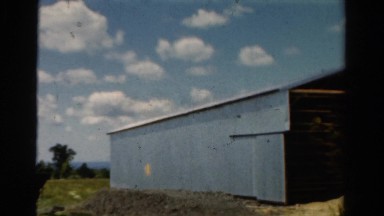 1954: unique farmhouse barn in the country under the beautiful blue skies