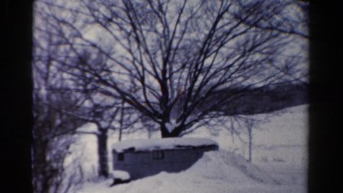 1954: a snow covered countryside landscape under a cloudy sky OHIO