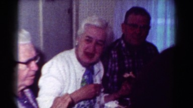 1954: indoor party drinks talk dressed christmas family OHIO