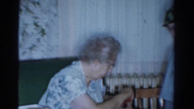 1954: a little boy is playing army in front of his family OHIO