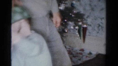 1954: Father and Son Playfully with Rifle on Christmas Day in Ohio