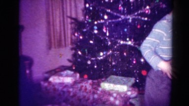 1954: a family having fun before a christmas tree OHIO
