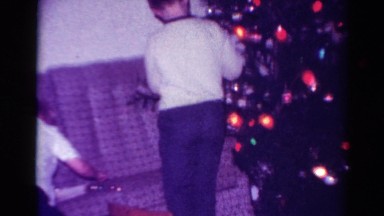 1954: decorating kid christmas tree indoor home scene OHIO