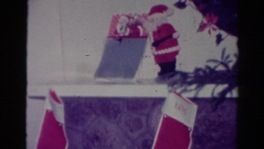 1954: vintage home video of christmas decorations such as stockings, figurines