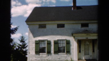 1954: a two-story home with distressed siding and shutters OHIO