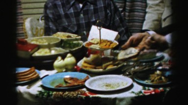 1956: man is being greedy at the dinner party NEW YORK