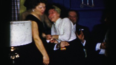 1956: a party with couples and women are laughing NEW YORK
