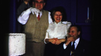 1956: a group of people are hamming for the camera and drinking at a party