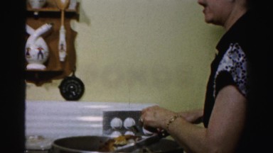 1956: mother cook food cutting chicken back posed NEW YORK
