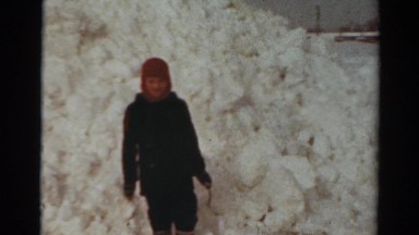 1954: kid poses huge mountain snow cold weather NEW YORK