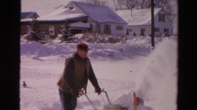 1954: 2 older men clearing snow from driveway after winter storm NEW YORK