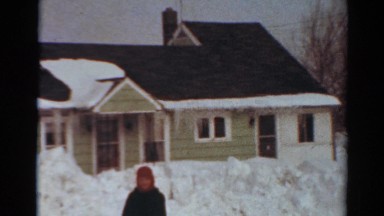 1954: neighborhood homes covered in snow, as well as massive snow banks NEW YORK