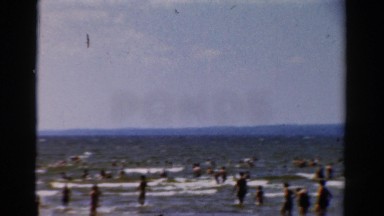 1954: people at the beach caught having a dip in the water