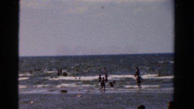 1954: people playing and swimming in the surf along the coast NEW YORK