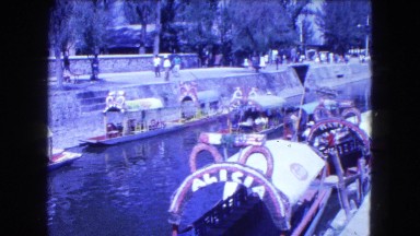 1962: sidewalk by tourist river boats MEXICO
