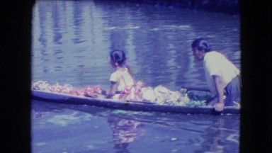 1962: indigenous family life rowing on a river MEXICO