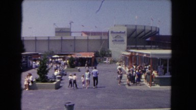 1962: People Walking Through Parking Lot Toward Large Outdoor Stadium in San Pedro, California