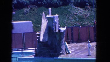 1962: a seal performs a trick at a water park by diving from a rock