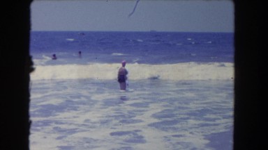 1962: the waves of the sea come crashing into the excited swimmers SAN PEDRO