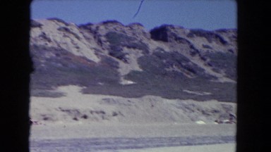 1962: panoramic view of dry dusty desolate mountains in the distant