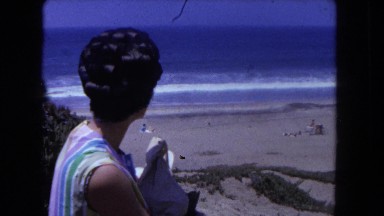 1962: perfectly coiffed lady is commenting on the lovely view from the shore
