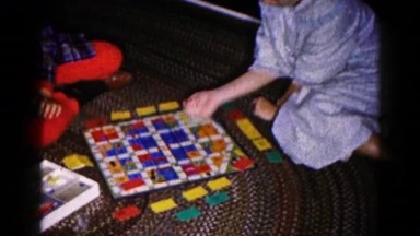 1959: children in pajamas on the floor playing a colorful board game HAGERSTOWN