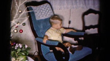 1959: a child enjoying a comfortable and decorative rocking chair HAGERSTOWN